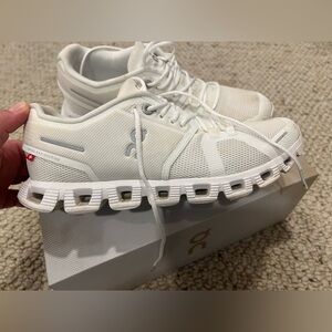 On Cloud white sneakers.